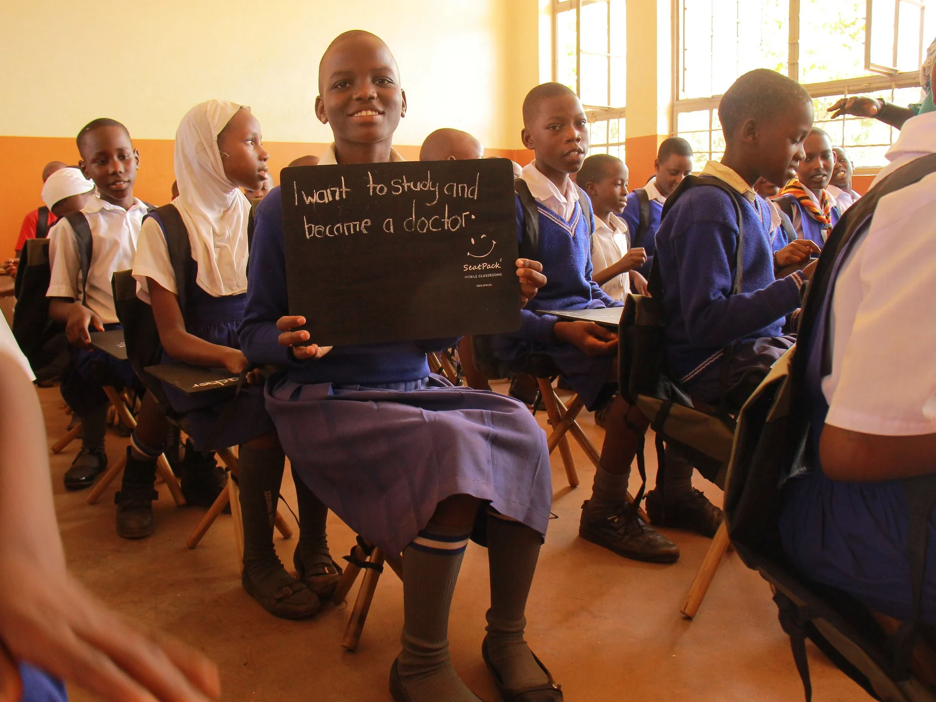 Smiling children with their new Seatpacks